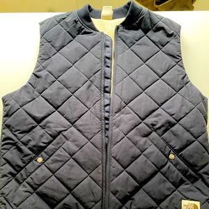 The North Face full-zip quilted vest.Sherpa lined. Bomber collar.Mens Size large